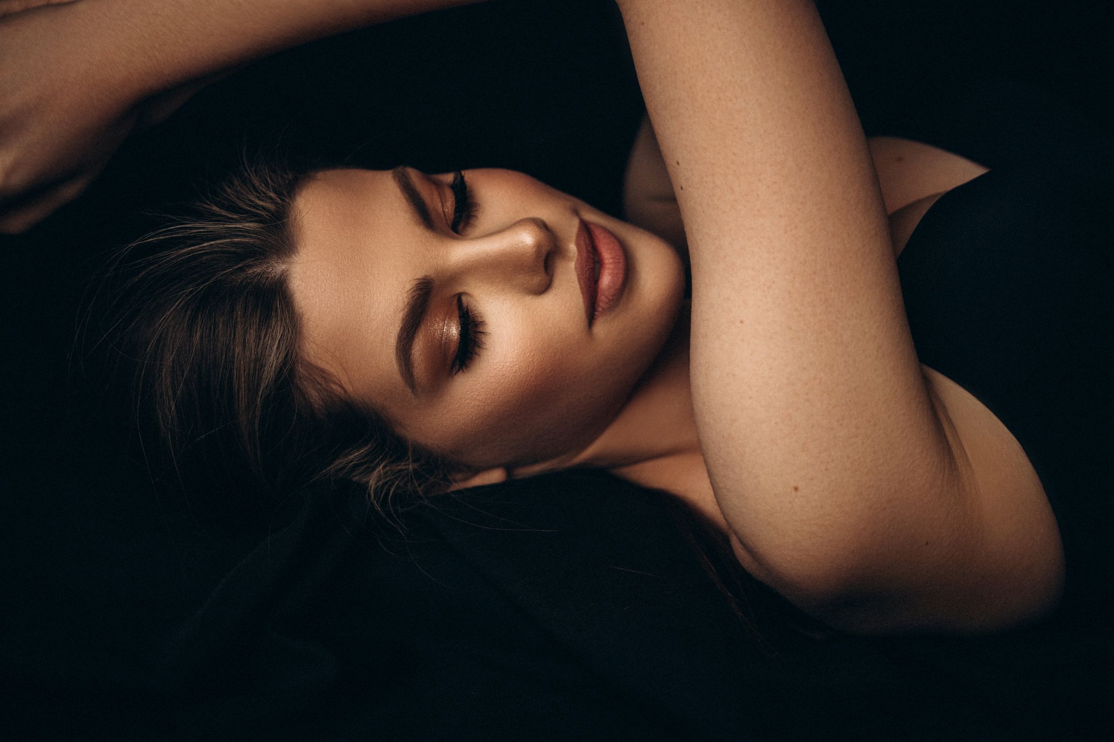 Woman with closed eyes and soft expression.