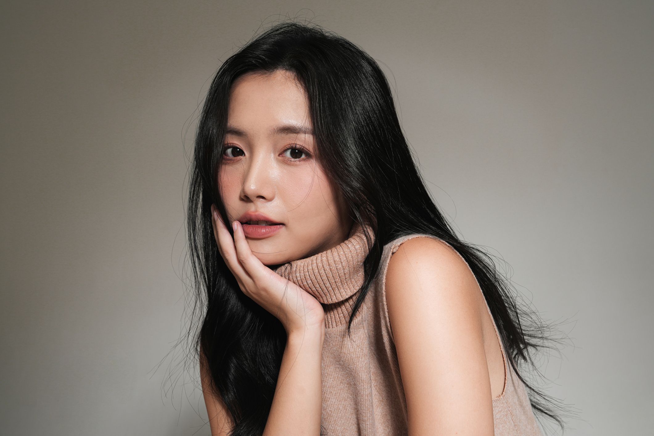 Portrait of a woman with black hair.